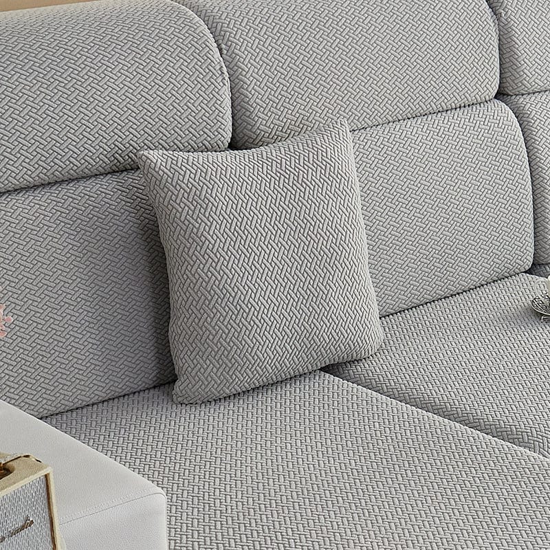 Kissenbezug aus Fleece 45 × 45 cm — 1 Stück, Hellgrau Flechtmuster, auf einem Sofa